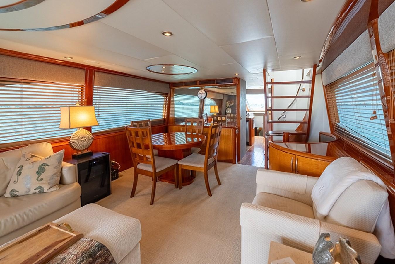 a living room with a bunk bed aboard BODACIOUS VI Yacht for Sale