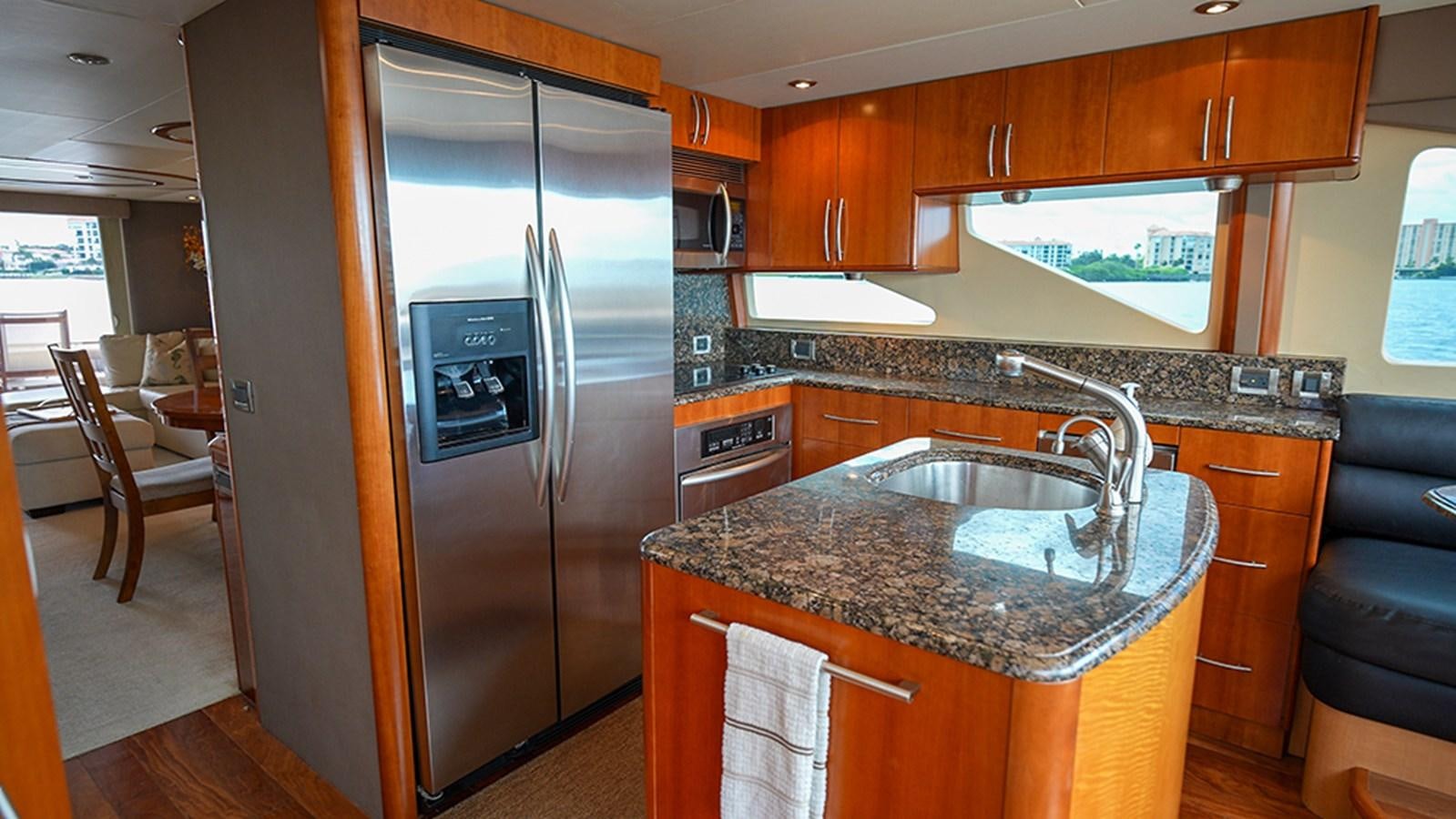 a kitchen with stainless steel appliances aboard BODACIOUS VI Yacht for Sale