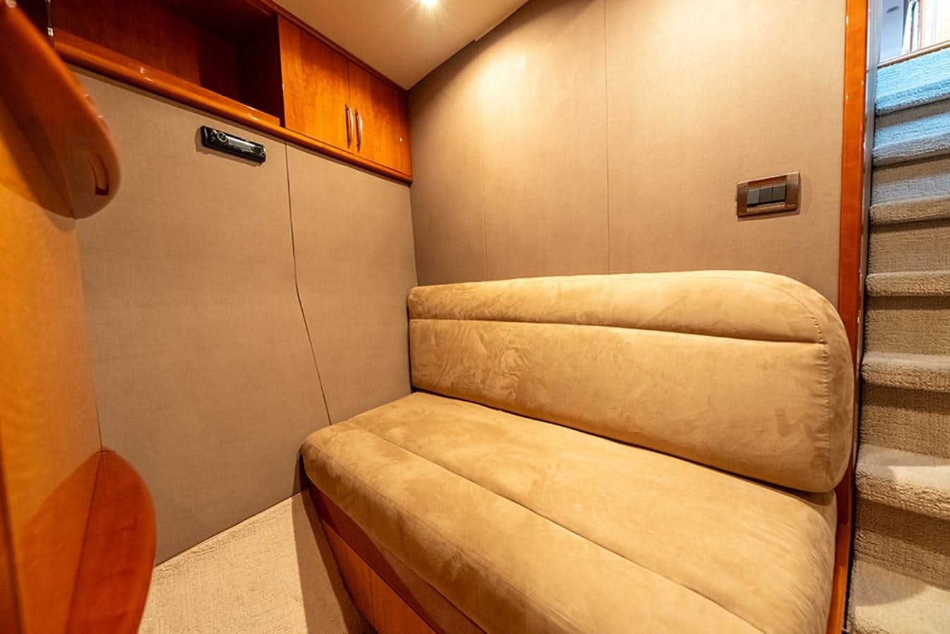 a couch in a room aboard BODACIOUS VI Yacht for Sale