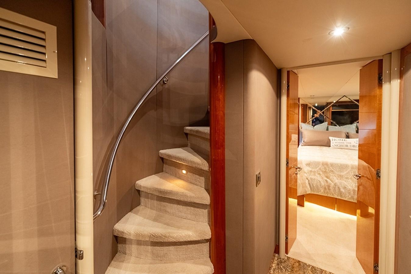 a staircase leading to a bedroom aboard BODACIOUS VI Yacht for Sale