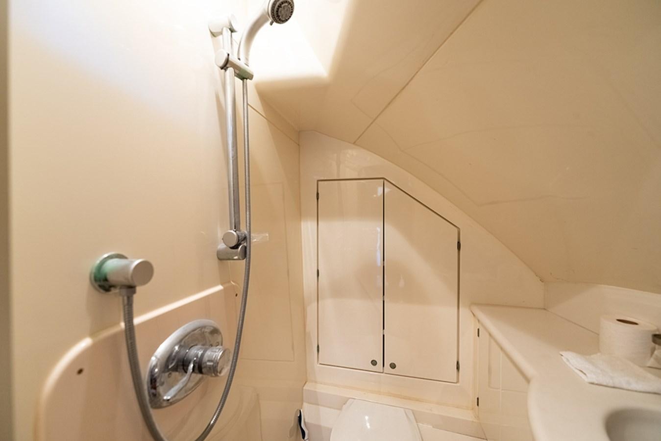 a bathroom with a shower unit aboard BODACIOUS VI Yacht for Sale