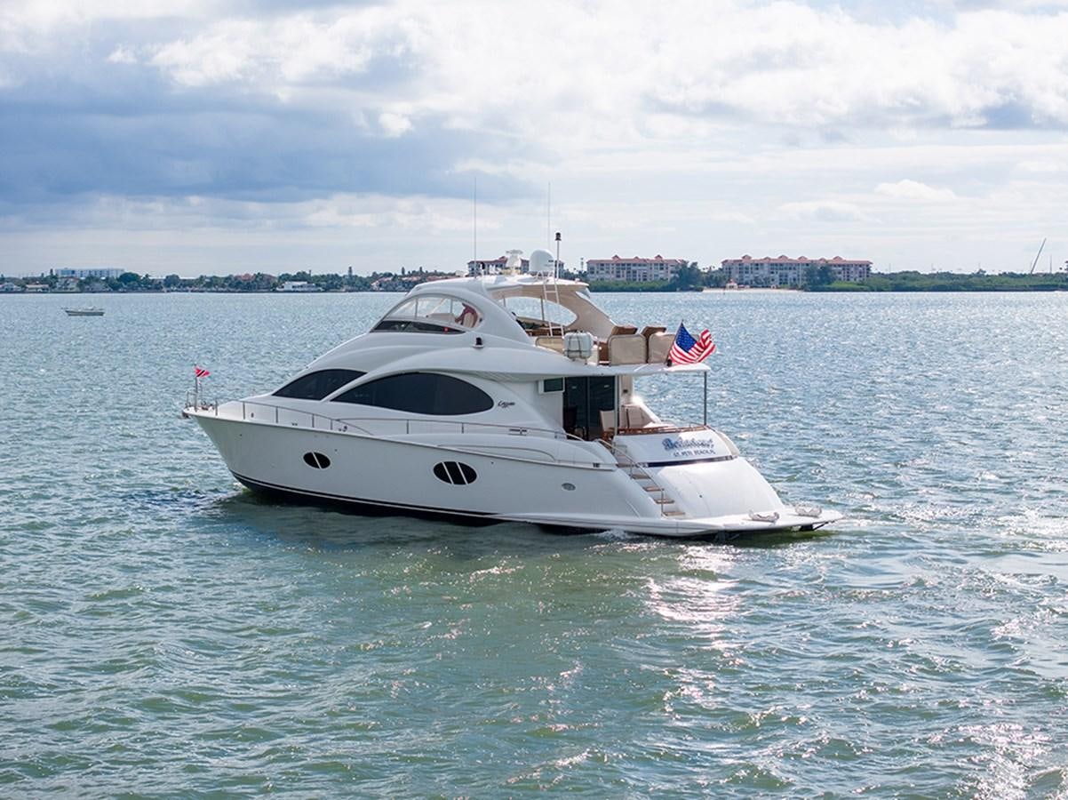 a white boat in the water aboard BODACIOUS VI Yacht for Sale