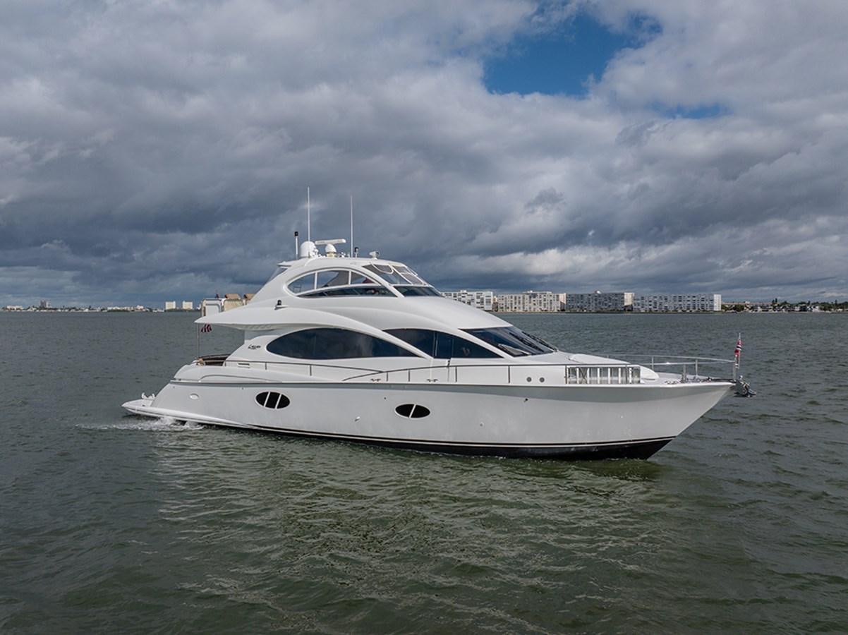 a white yacht in the water aboard BODACIOUS VI Yacht for Sale