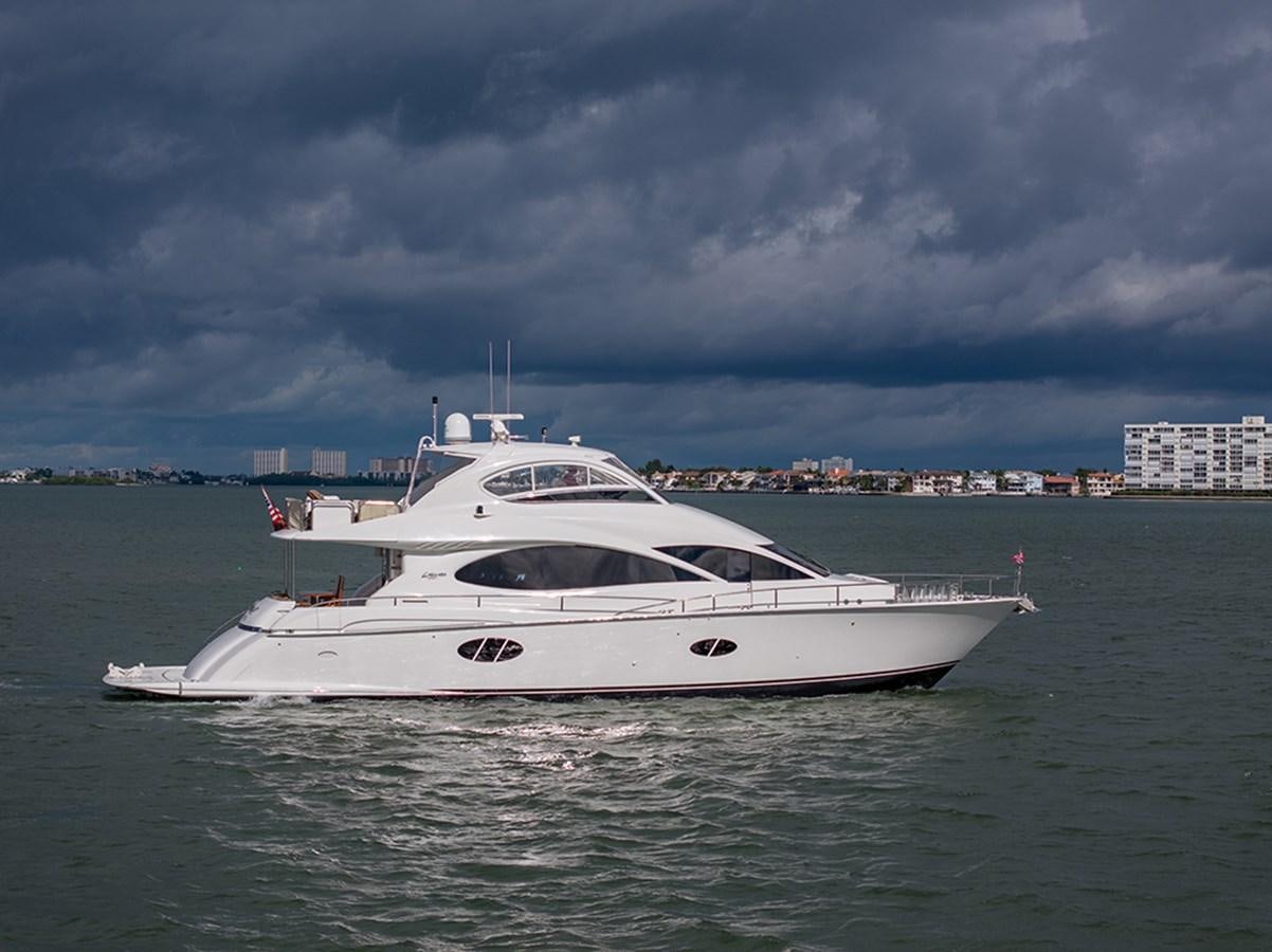 a white yacht in the water aboard BODACIOUS VI Yacht for Sale