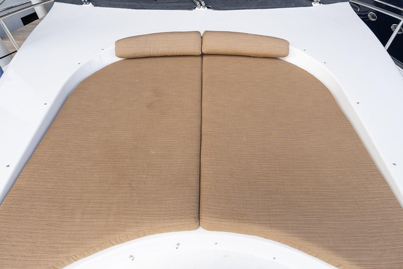a wooden block on a table aboard BODACIOUS VI Yacht for Sale