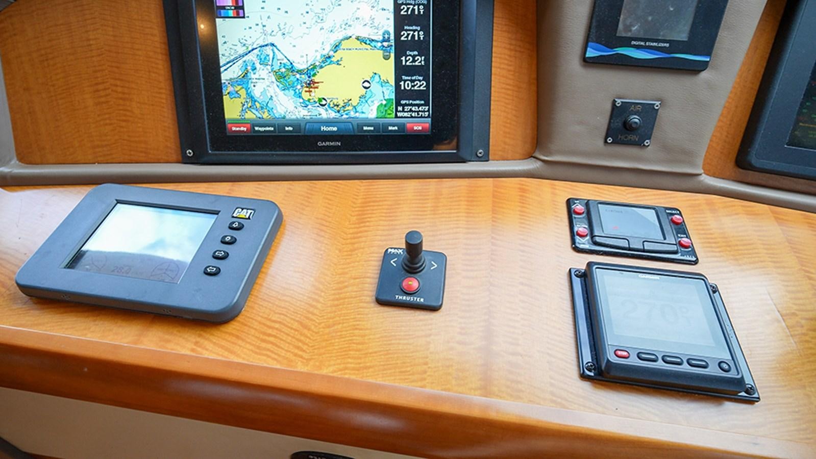 a group of cell phones on a table aboard BODACIOUS VI Yacht for Sale