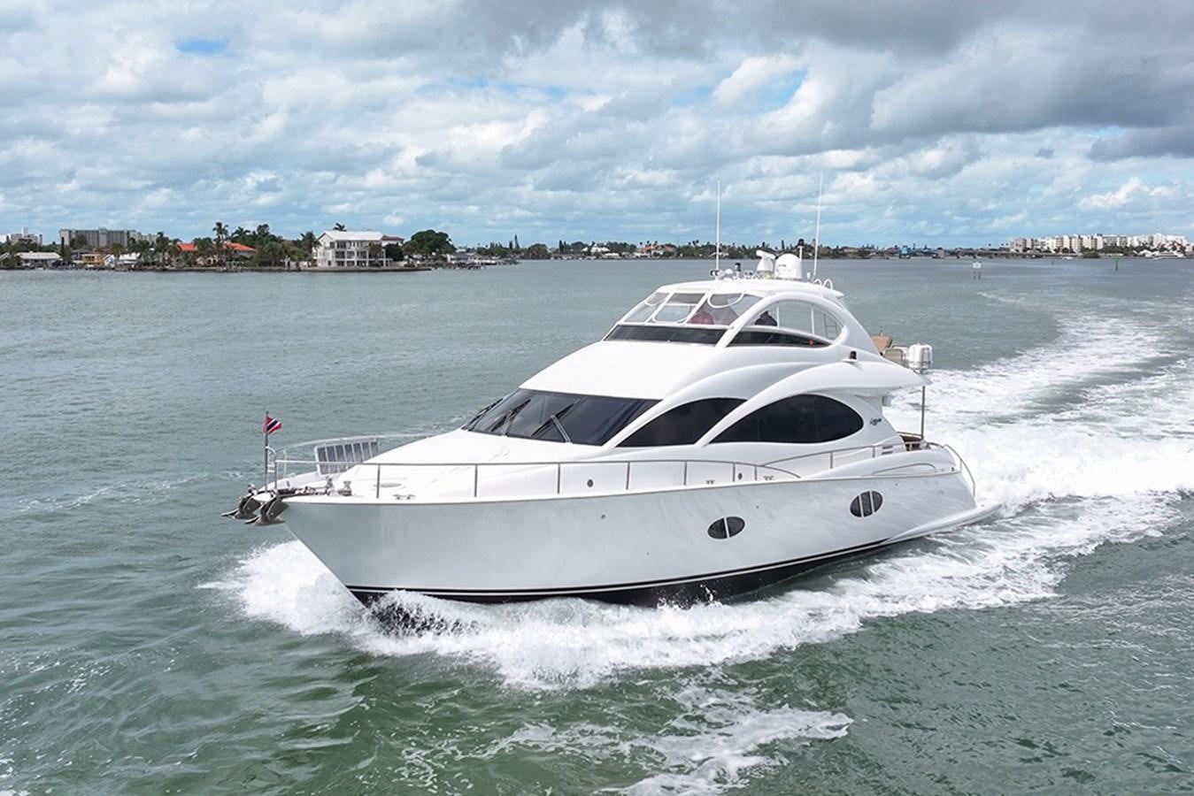 a white yacht on the water aboard BODACIOUS VI Yacht for Sale