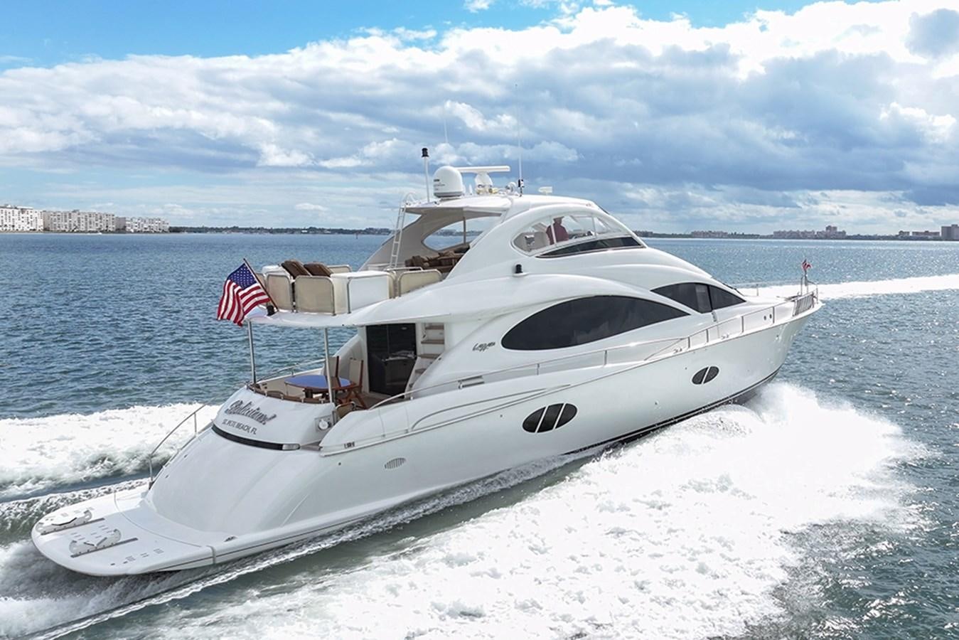 a white yacht on the water aboard BODACIOUS VI Yacht for Sale