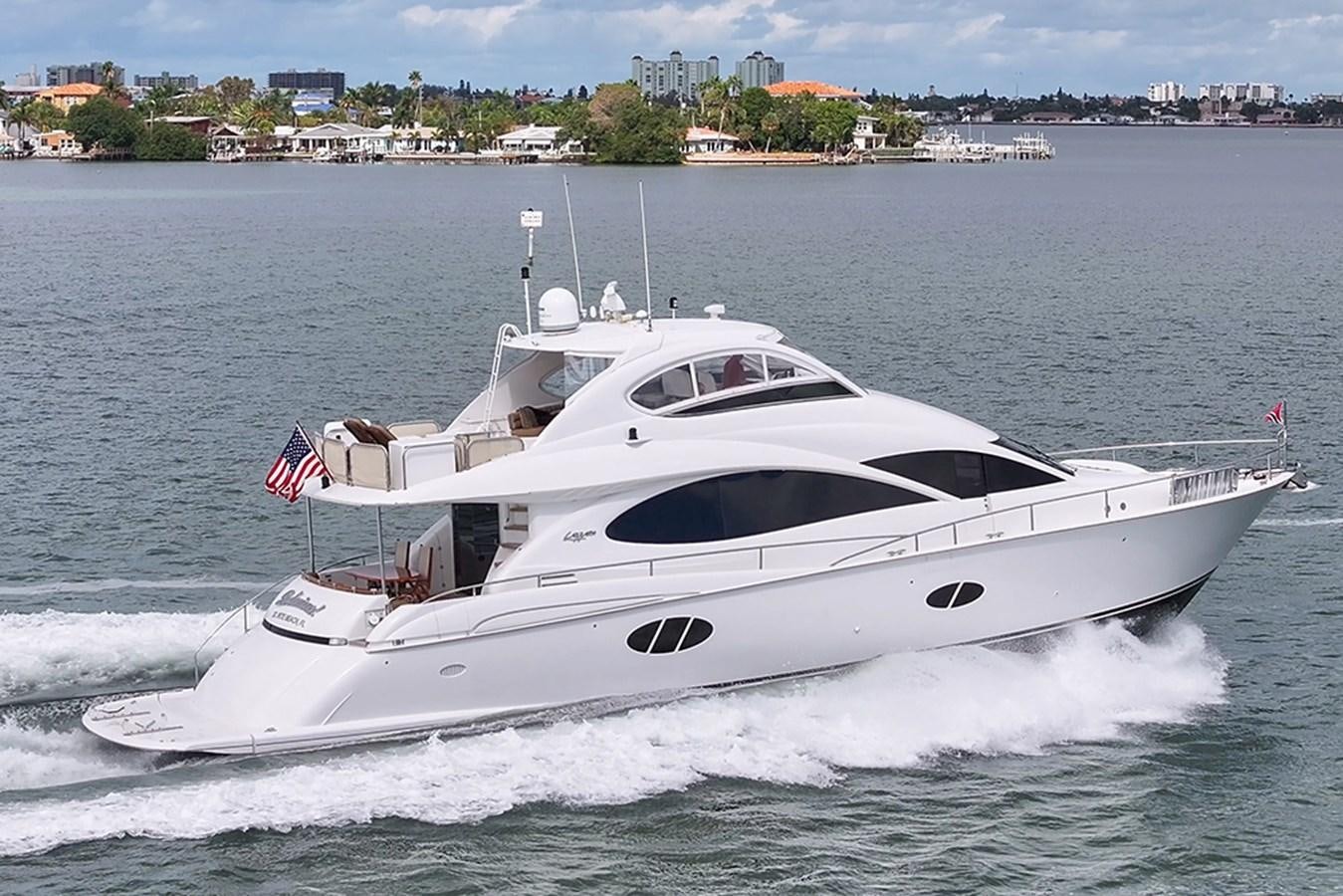 a white yacht on the water aboard BODACIOUS VI Yacht for Sale