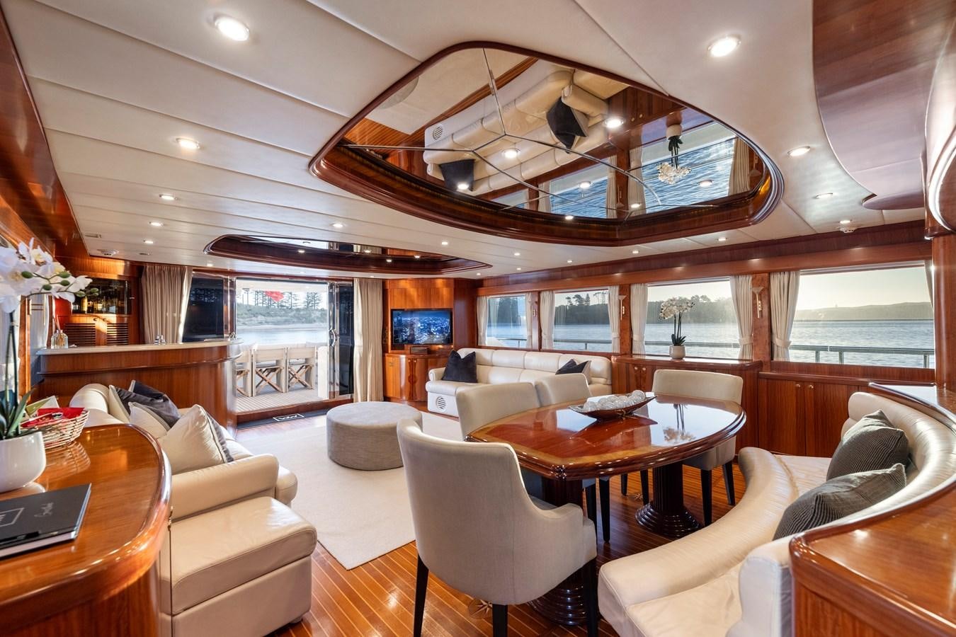 a living room with a large chandelier aboard WW Yacht for Sale