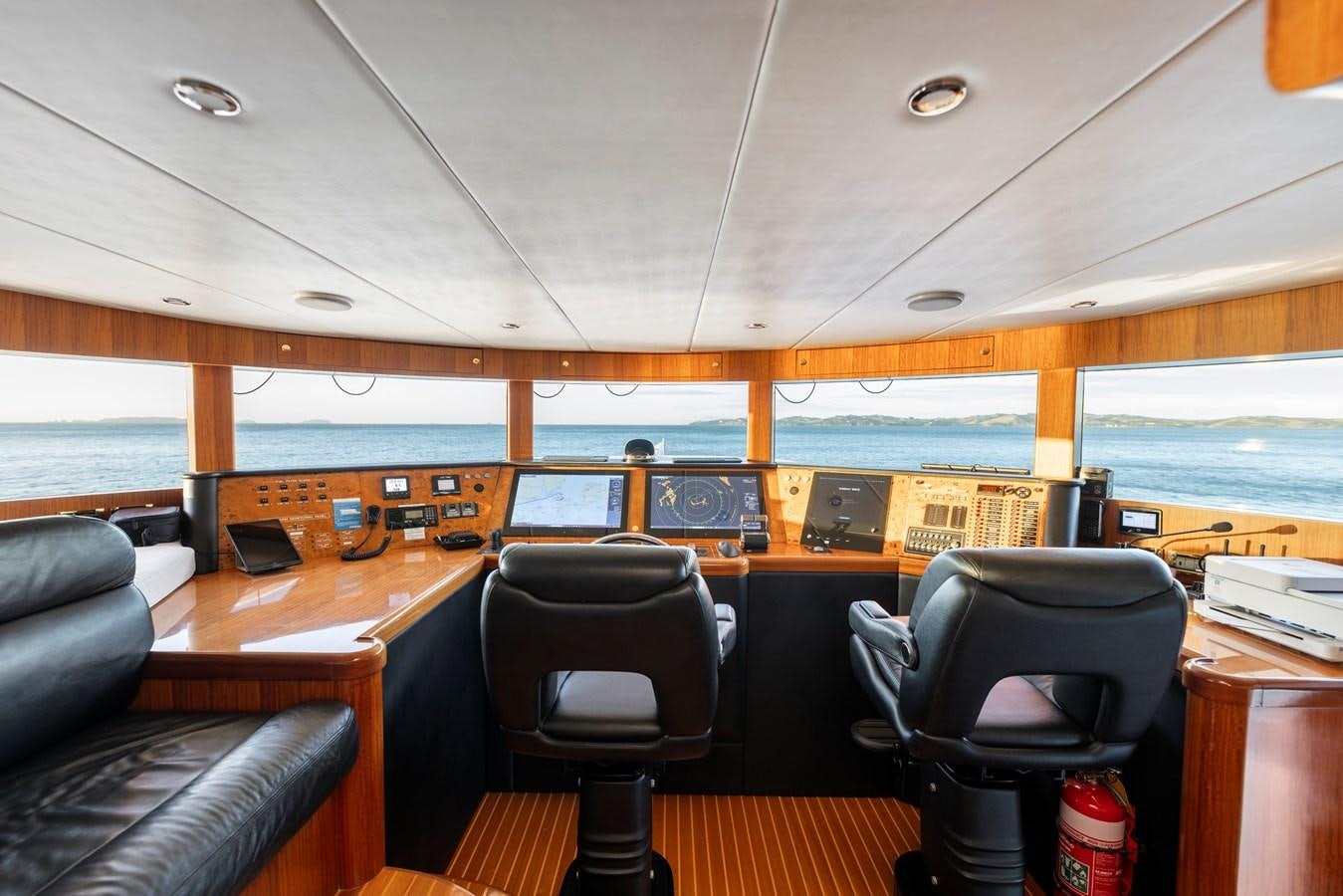 a boat with a desk and chairs aboard WW Yacht for Sale