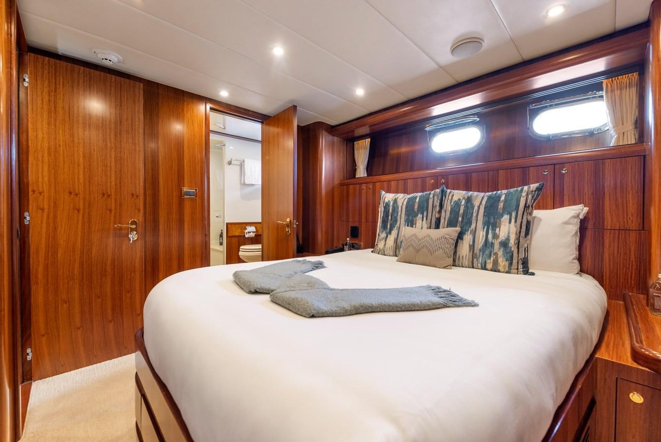 a bed in a room aboard WW Yacht for Sale