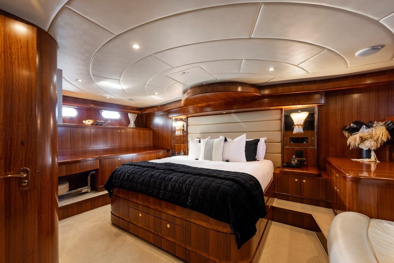 a room with a bed and a wood door aboard WW Yacht for Sale