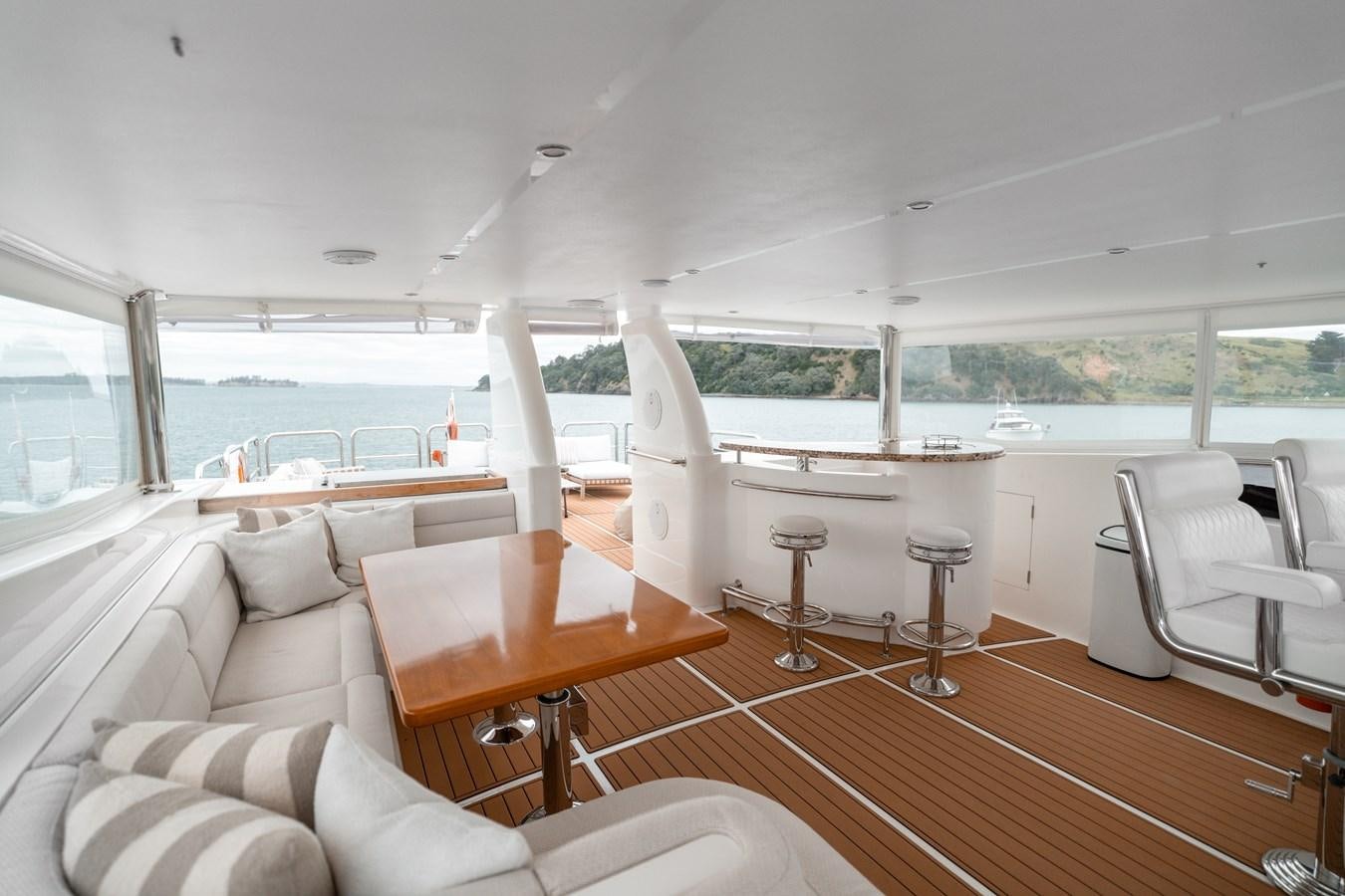 a living room with a large window aboard WW Yacht for Sale