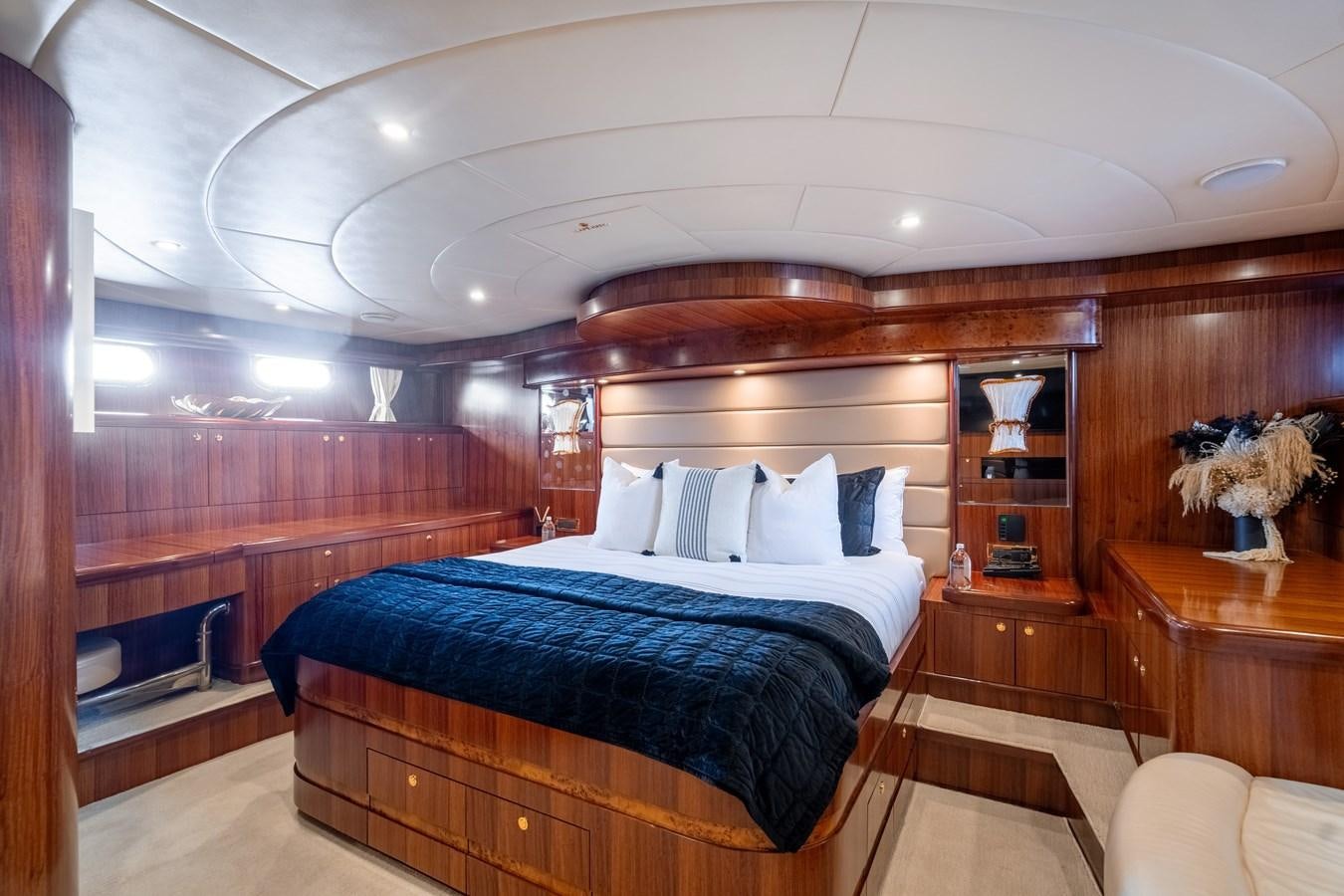 a room with a bed and a mirror aboard WW Yacht for Sale