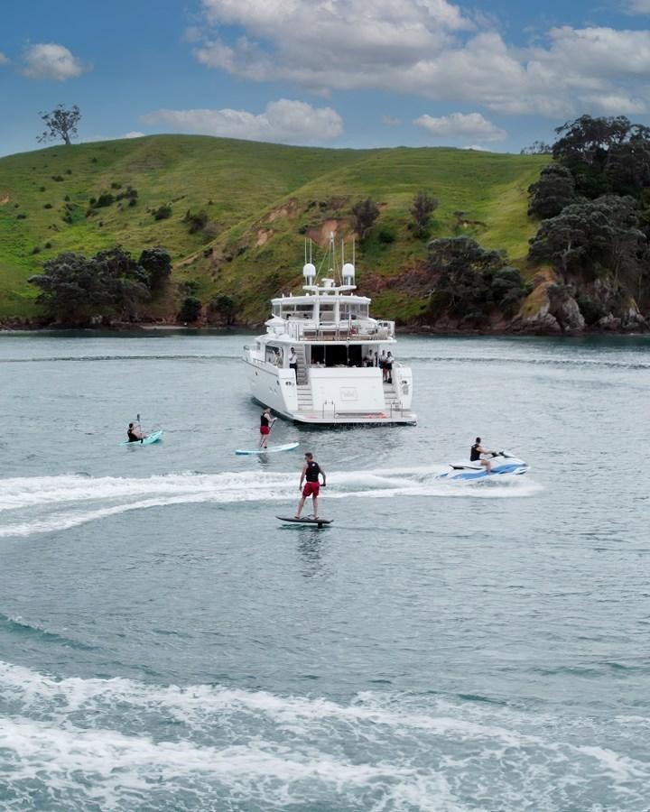 people are surfing in the sea aboard WW Yacht for Sale