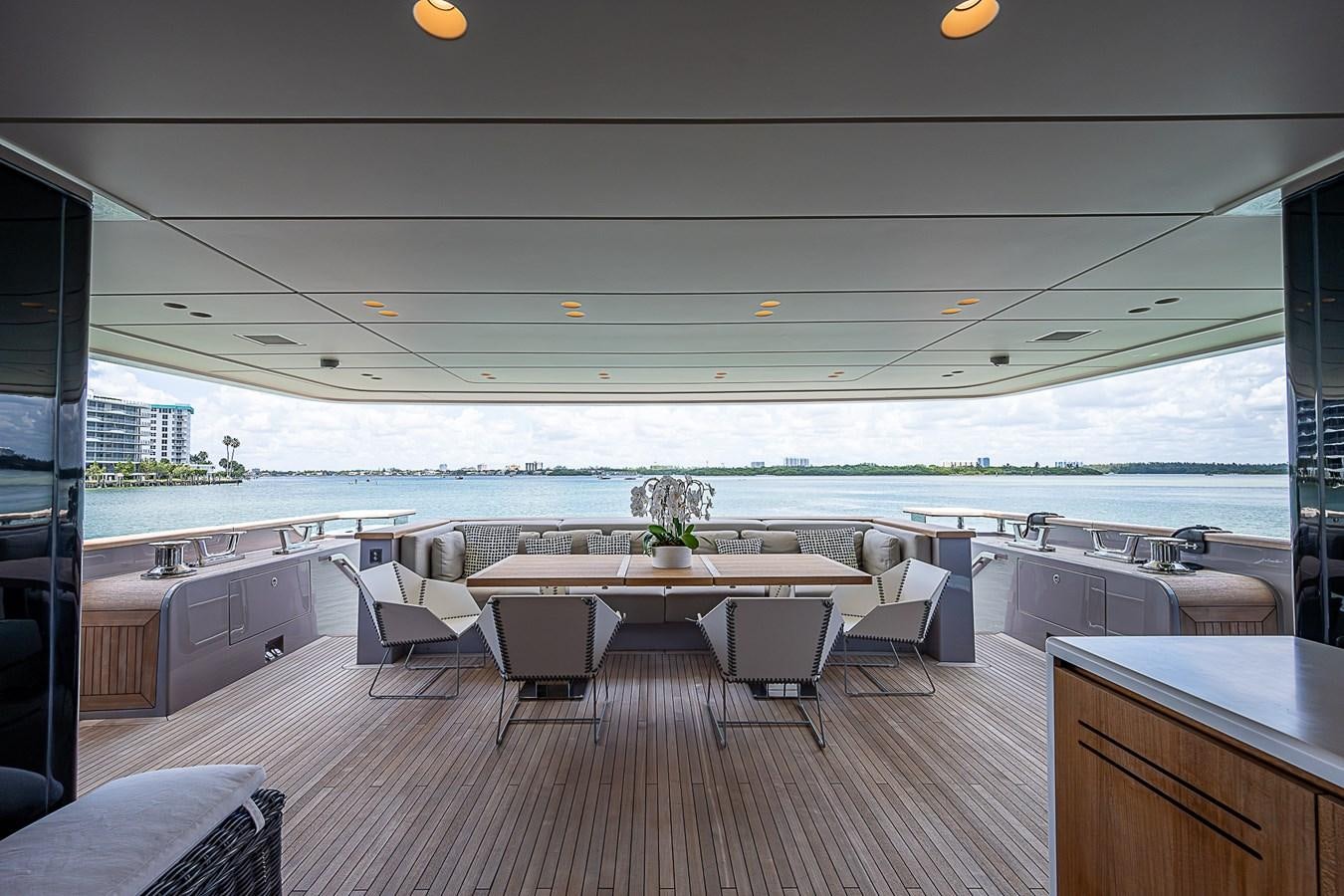 a room with a table and chairs aboard F 118 Yacht for Sale