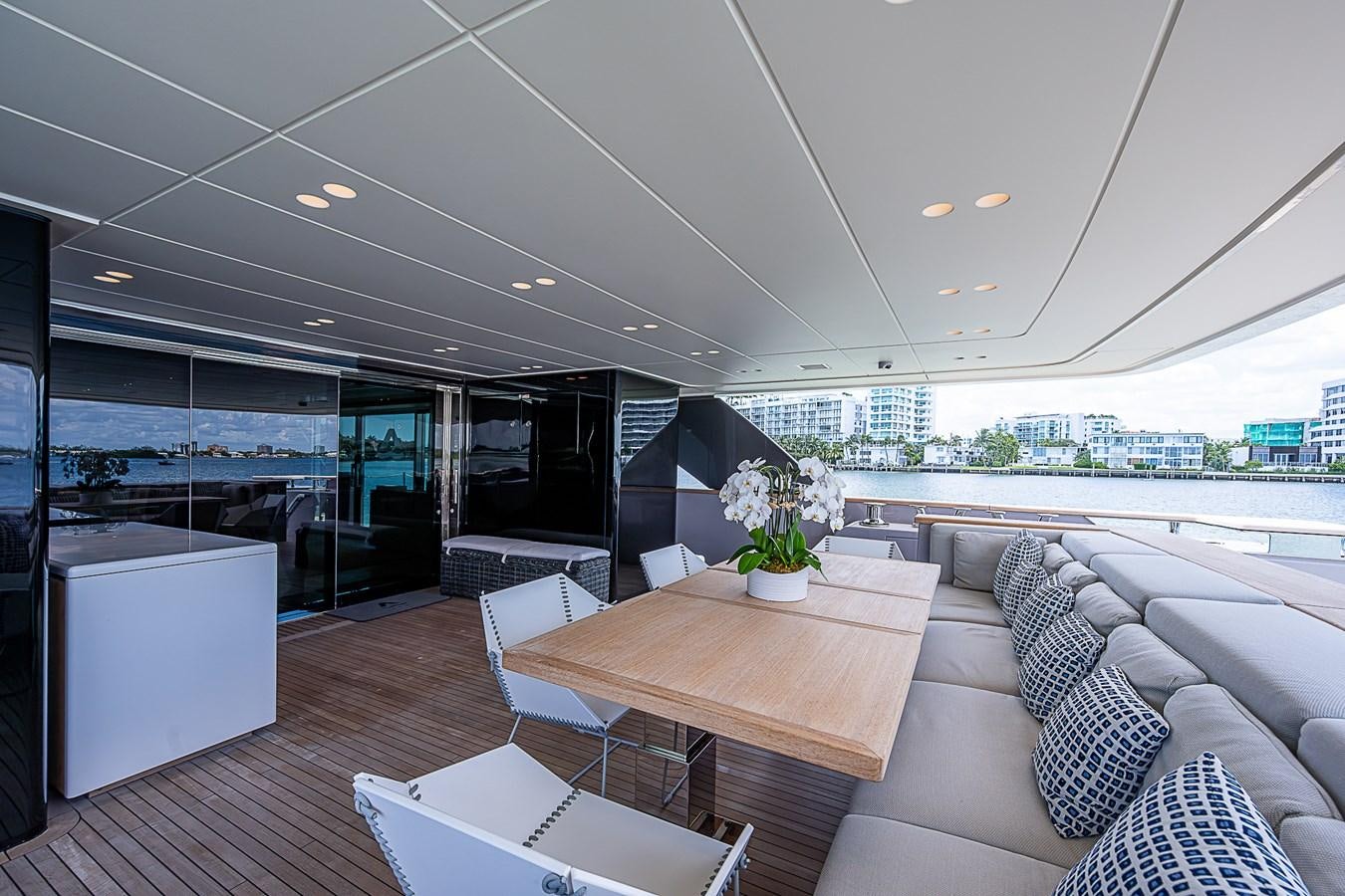 a room with a table and chairs aboard F 118 Yacht for Sale