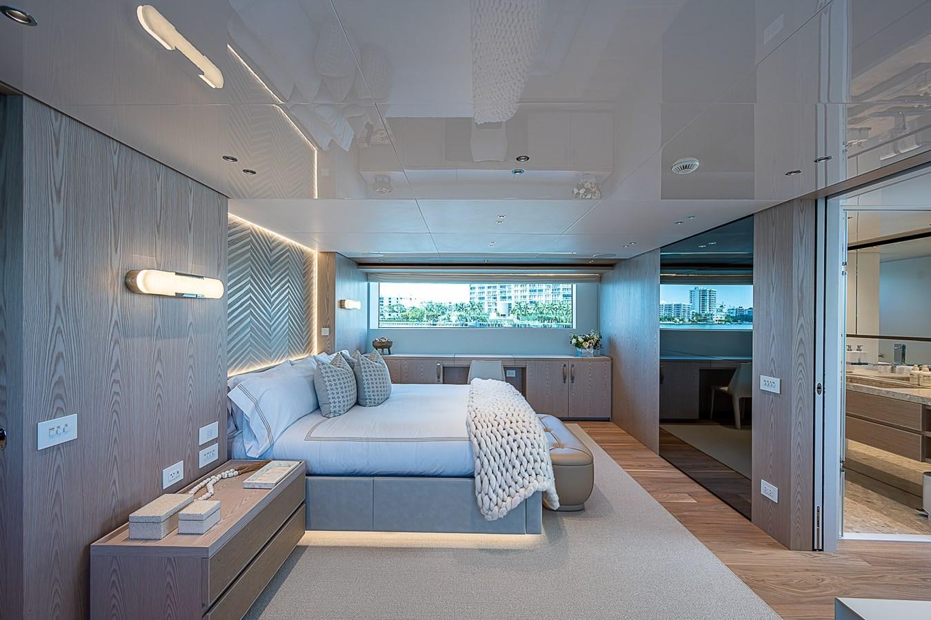 a bedroom with a bed and a desk aboard F 118 Yacht for Sale