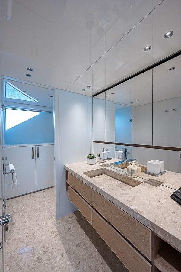 a bathroom with a countertop sink aboard F 118 Yacht for Sale