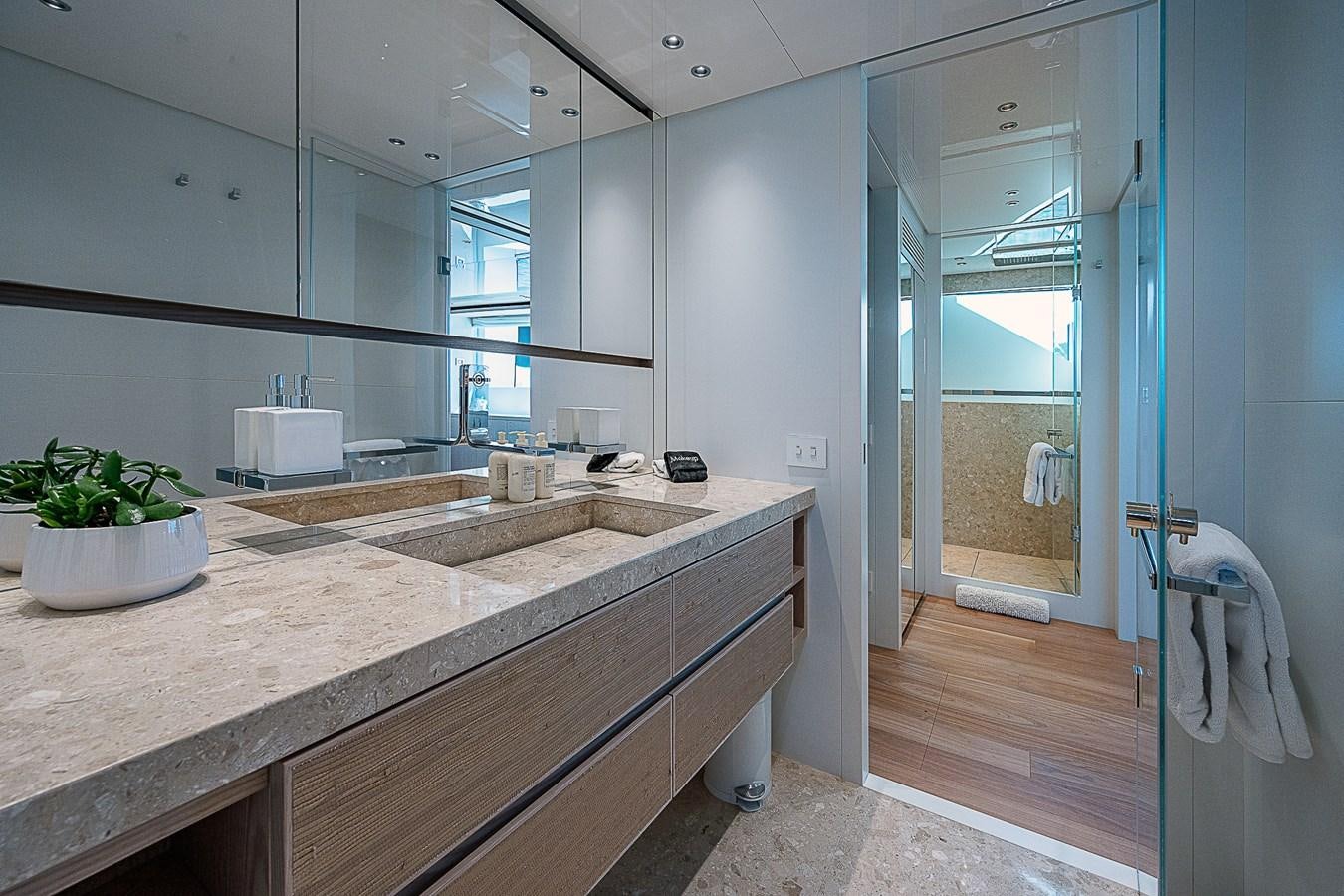 a bathroom with a countertop sink and a mirror aboard F 118 Yacht for Sale