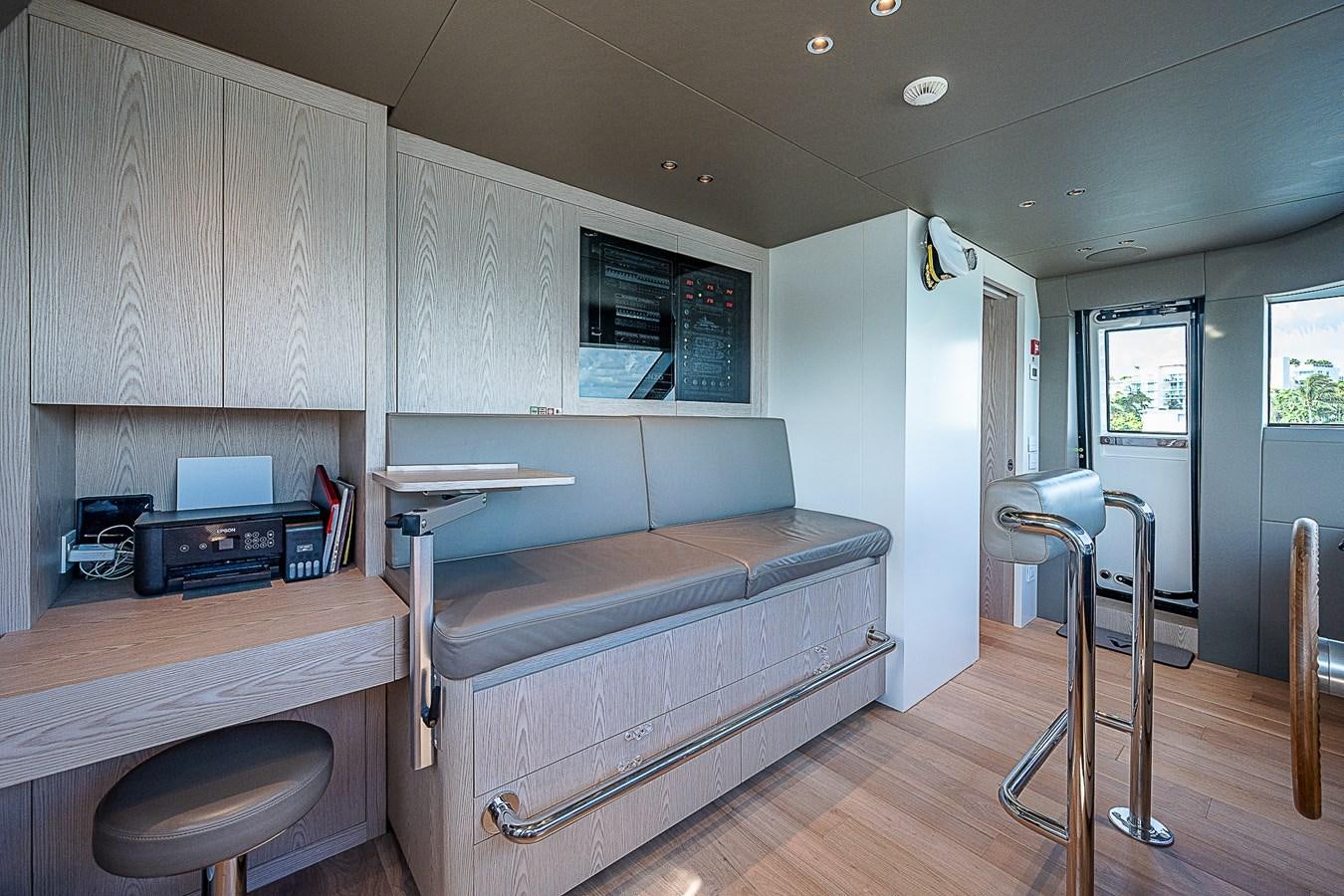 a living room with a couch and a table aboard F 118 Yacht for Sale