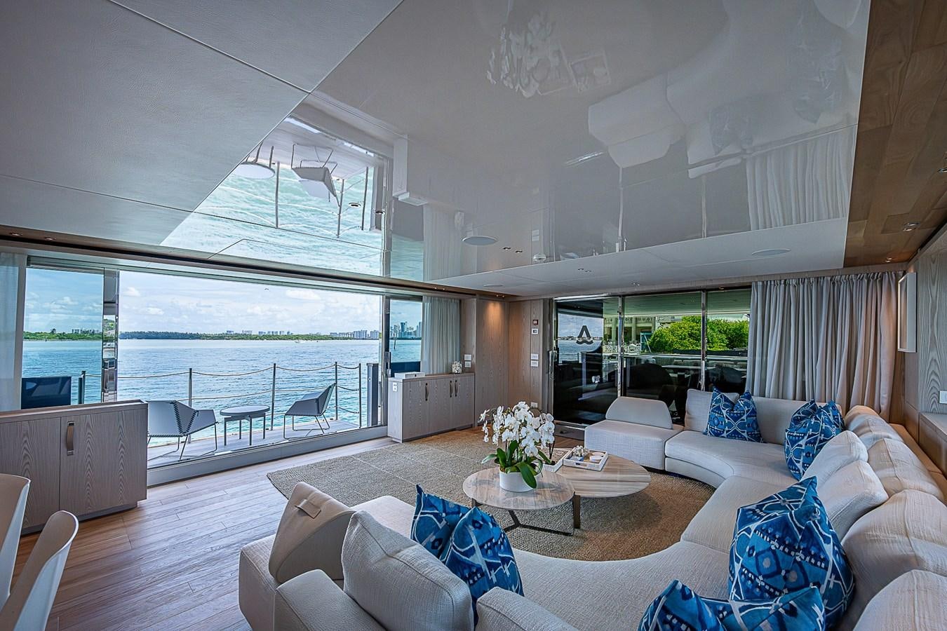 a living room with a large window aboard F 118 Yacht for Sale