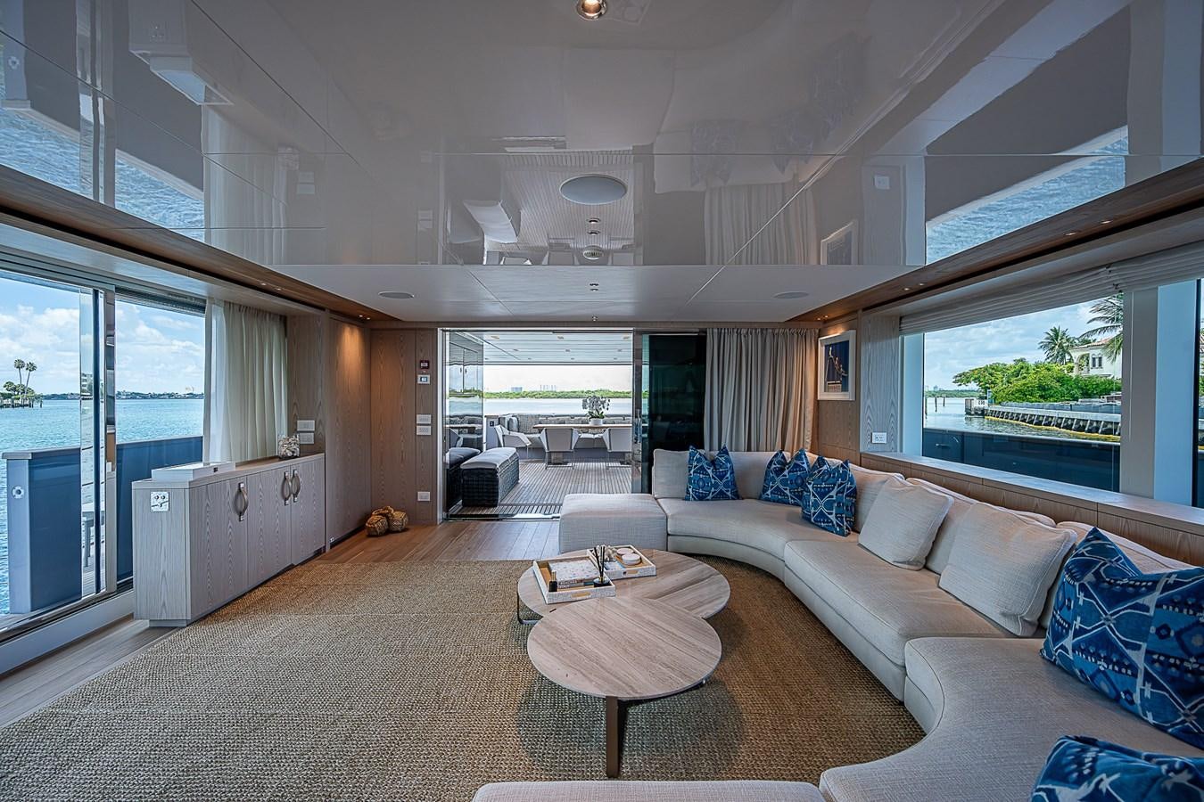 a living room with a large window aboard F 118 Yacht for Sale