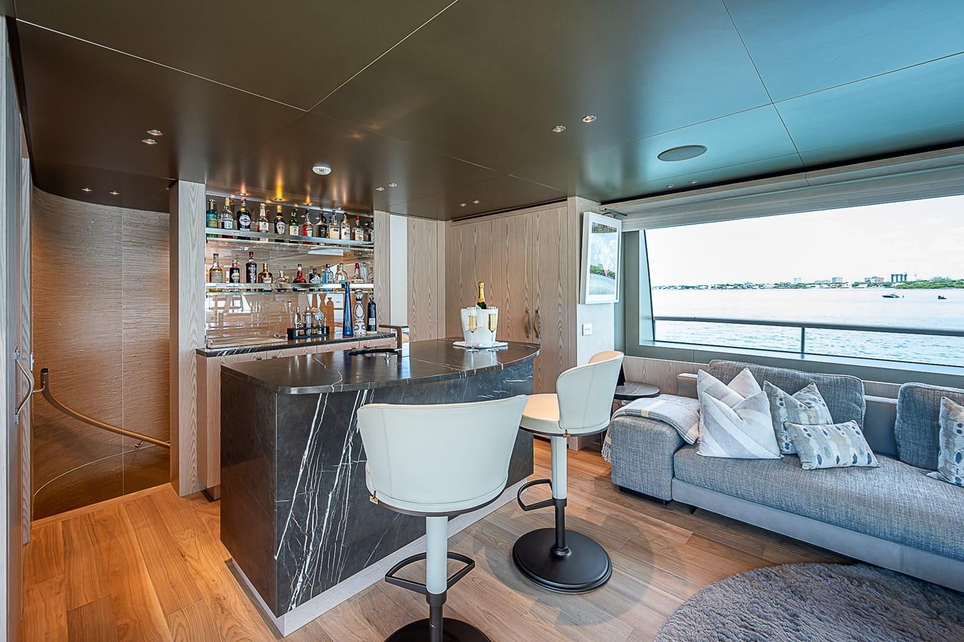 a living room with a couch and a table aboard F 118 Yacht for Sale