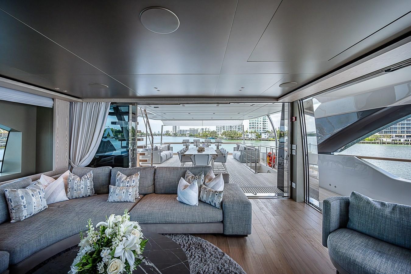 a living room with a large window aboard F 118 Yacht for Sale