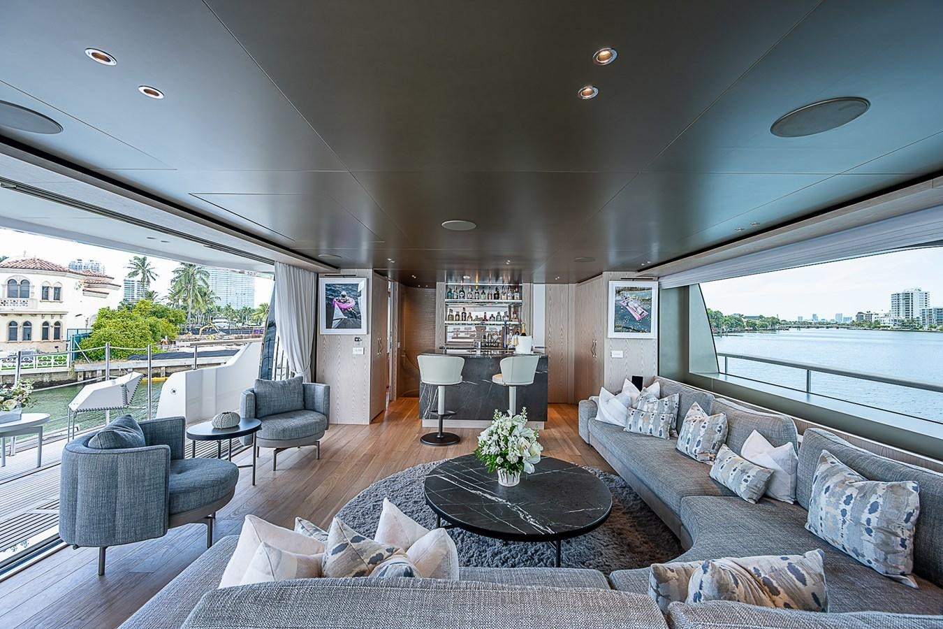 a living room with a large window aboard F 118 Yacht for Sale