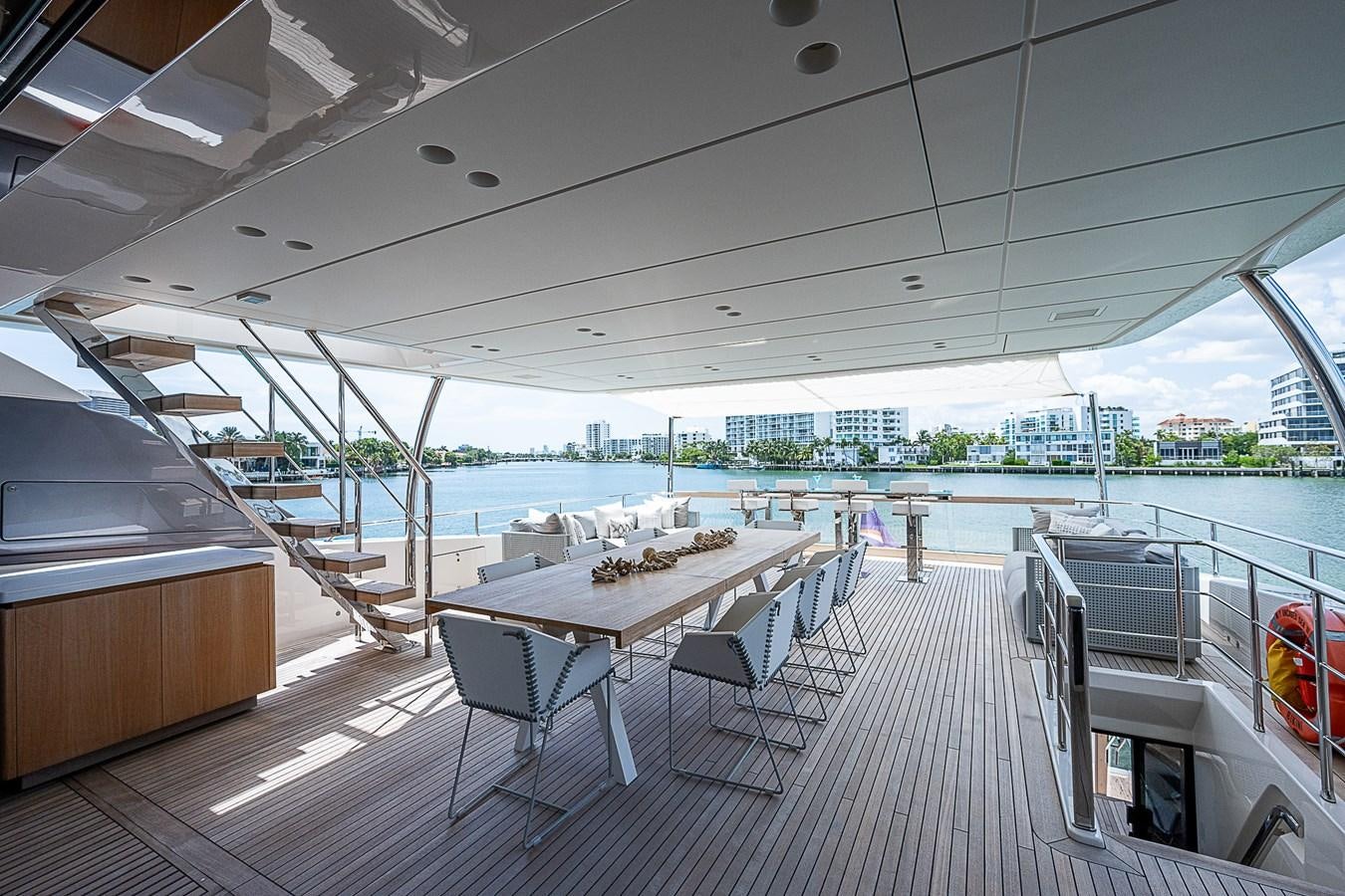 a table and chairs on a deck aboard F 118 Yacht for Sale