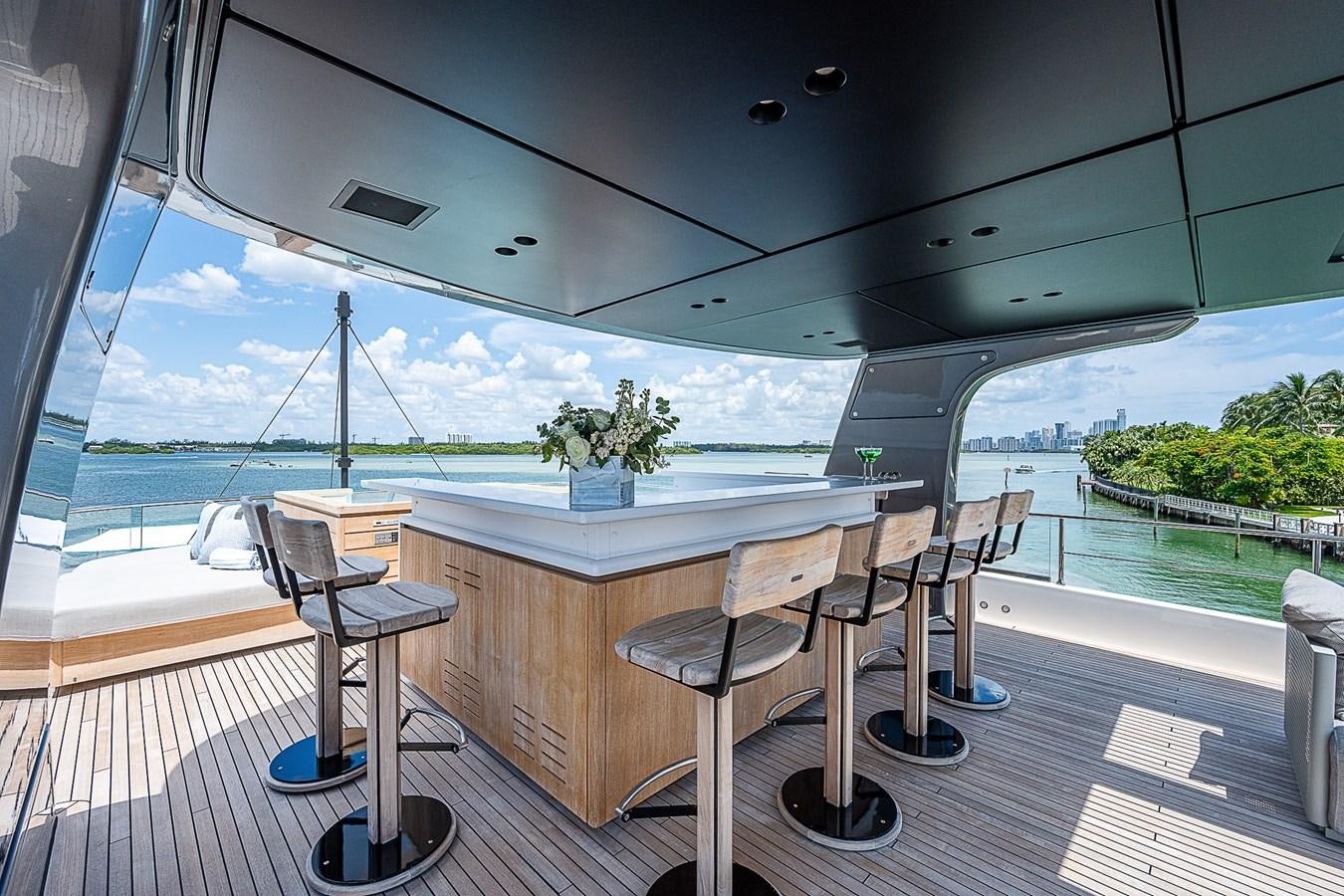 a table and chairs on a deck aboard F 118 Yacht for Sale