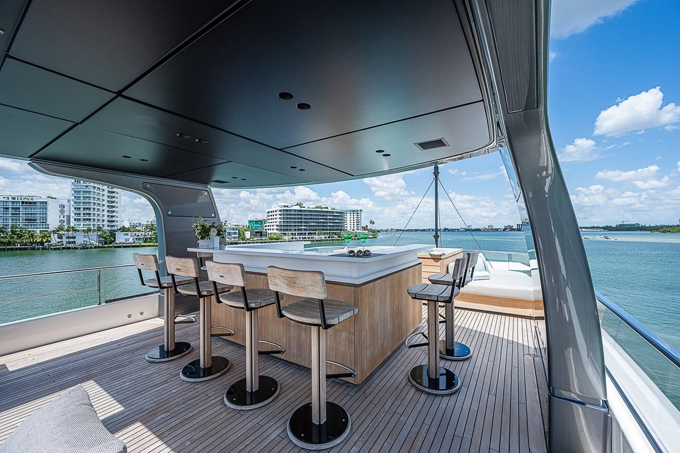 a table and chairs on a deck aboard F 118 Yacht for Sale