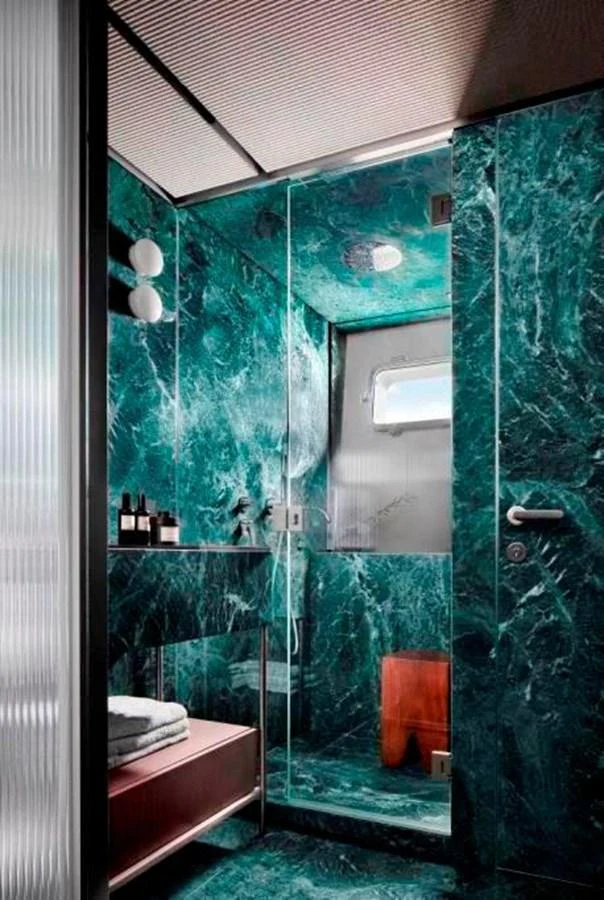 a bathroom with glass walls aboard ALMAX Yacht for Sale