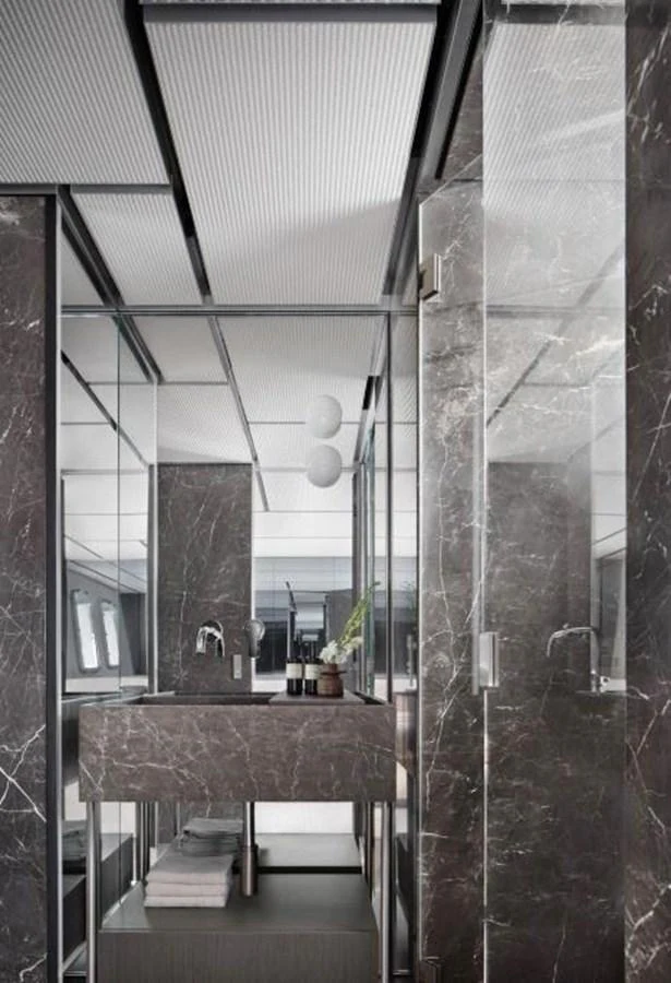 a bathroom with a marble countertop aboard ALMAX Yacht for Sale