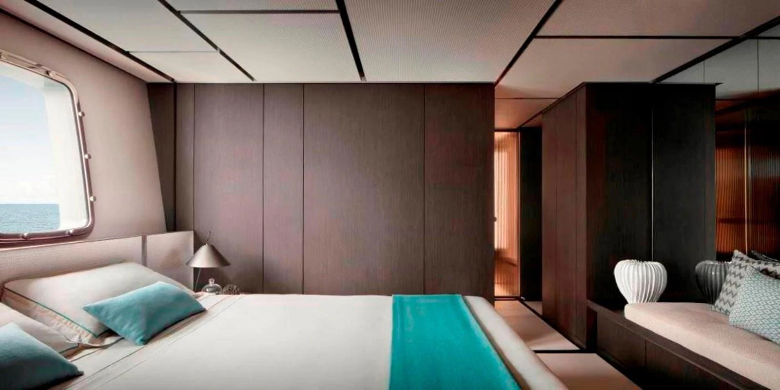 a room with a bed and a couch aboard ALMAX Yacht for Sale