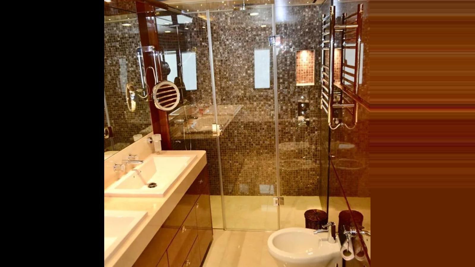 a bathroom with a sink and a shower aboard ASPIRATION Yacht for Sale