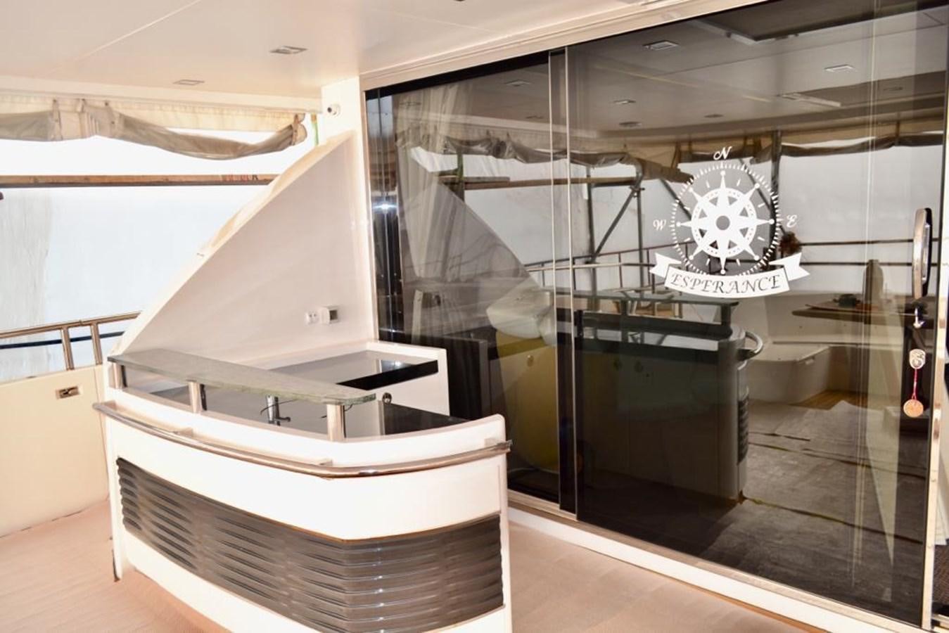 a large room with a large glass wall and a white table aboard ASPIRATION Yacht for Sale