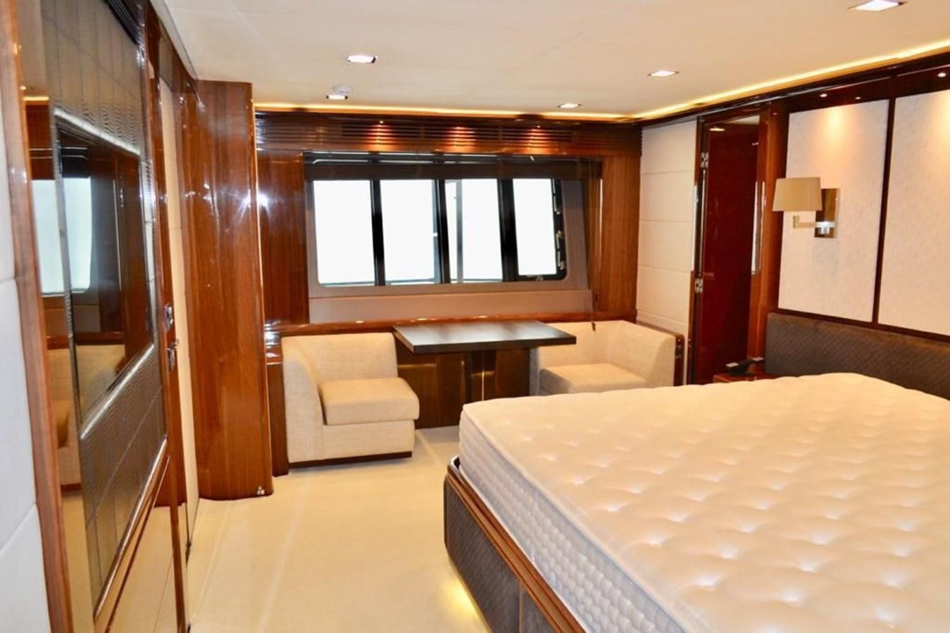 a room with a bed and a table aboard ASPIRATION Yacht for Sale