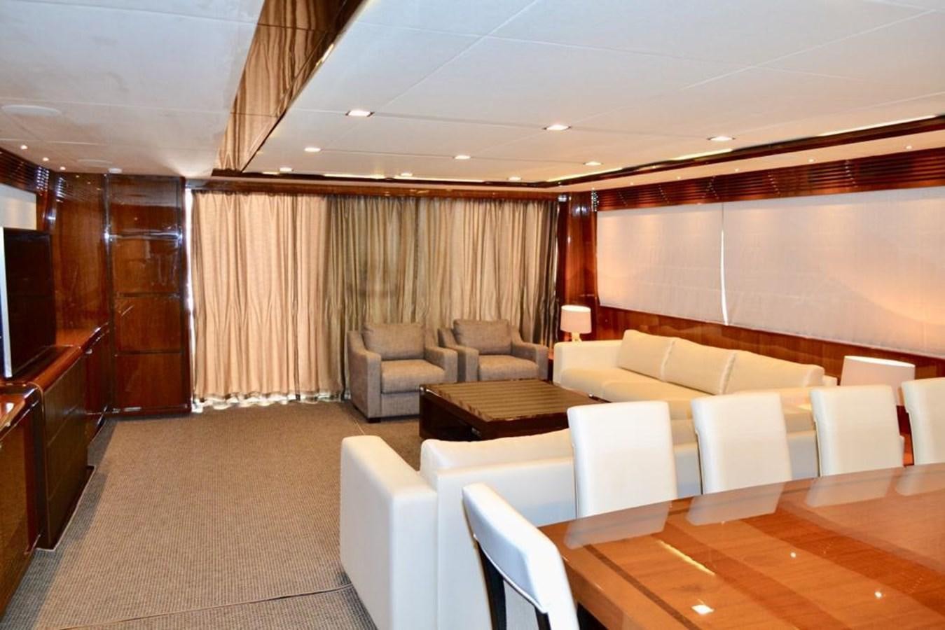a large room with couches and a table aboard ASPIRATION Yacht for Sale