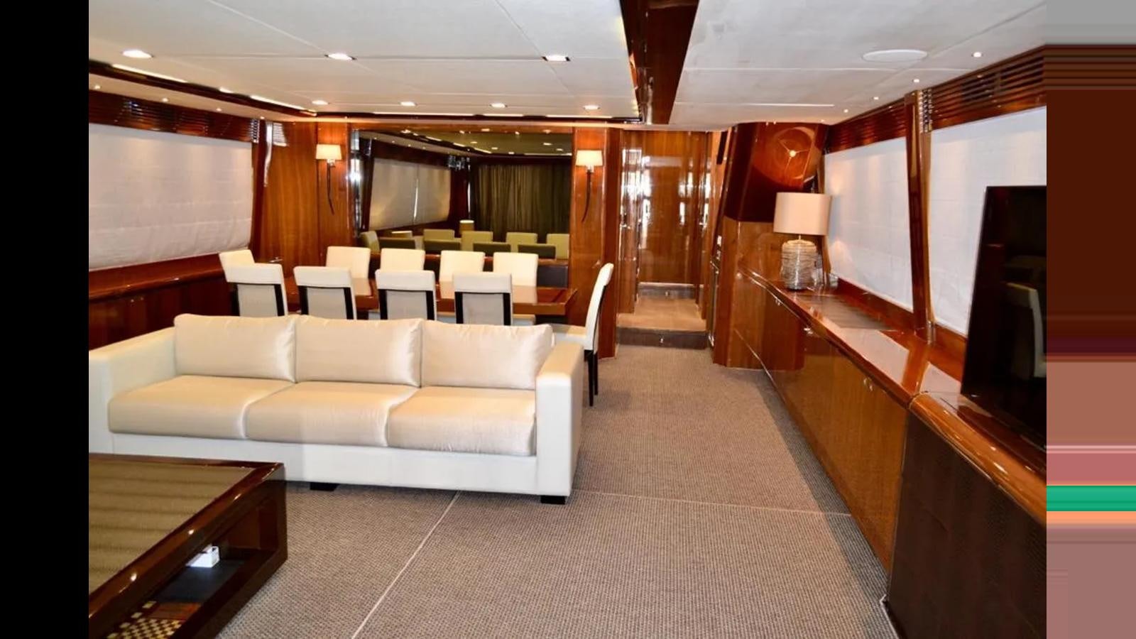 a large room with a couch and a table aboard ASPIRATION Yacht for Sale