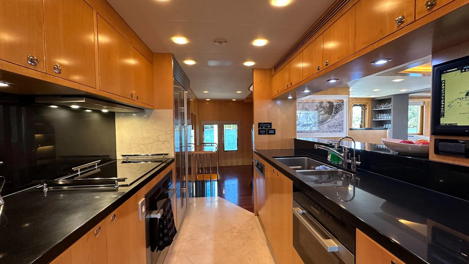 a kitchen with a large island aboard SALVATOR II Yacht for Sale