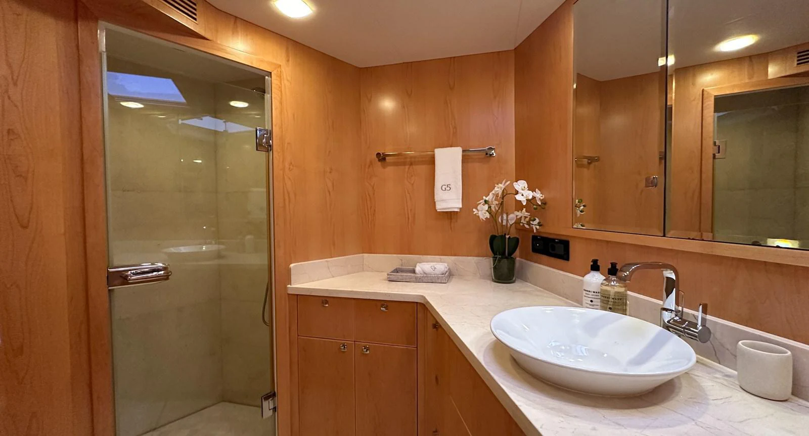 a bathroom with a sink and a mirror aboard SALVATOR II Yacht for Sale