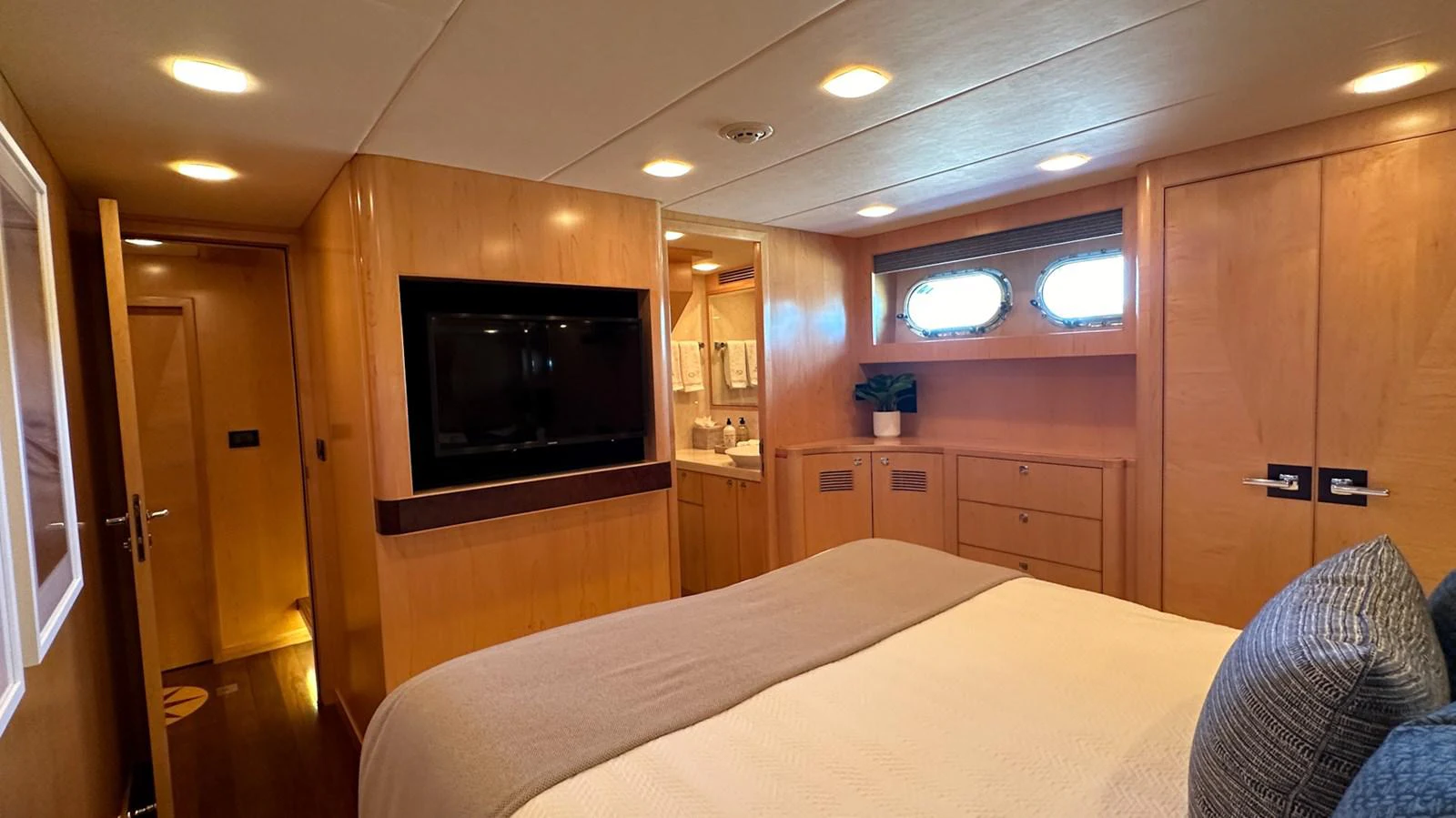 a bedroom with a bed and tv aboard SALVATOR II Yacht for Sale