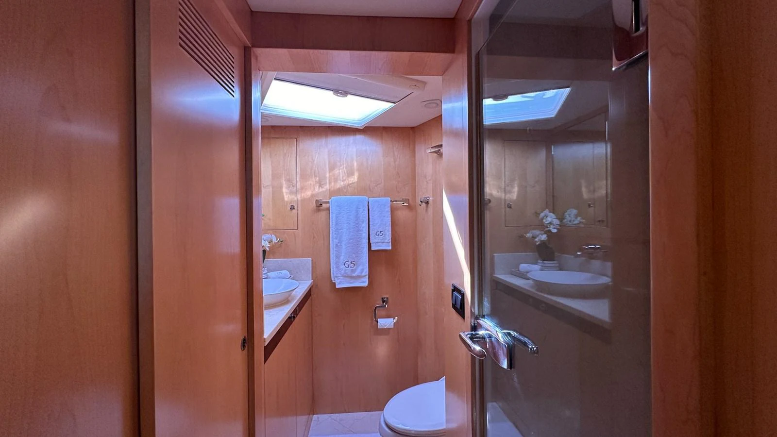 a bathroom with a glass shower aboard SALVATOR II Yacht for Sale
