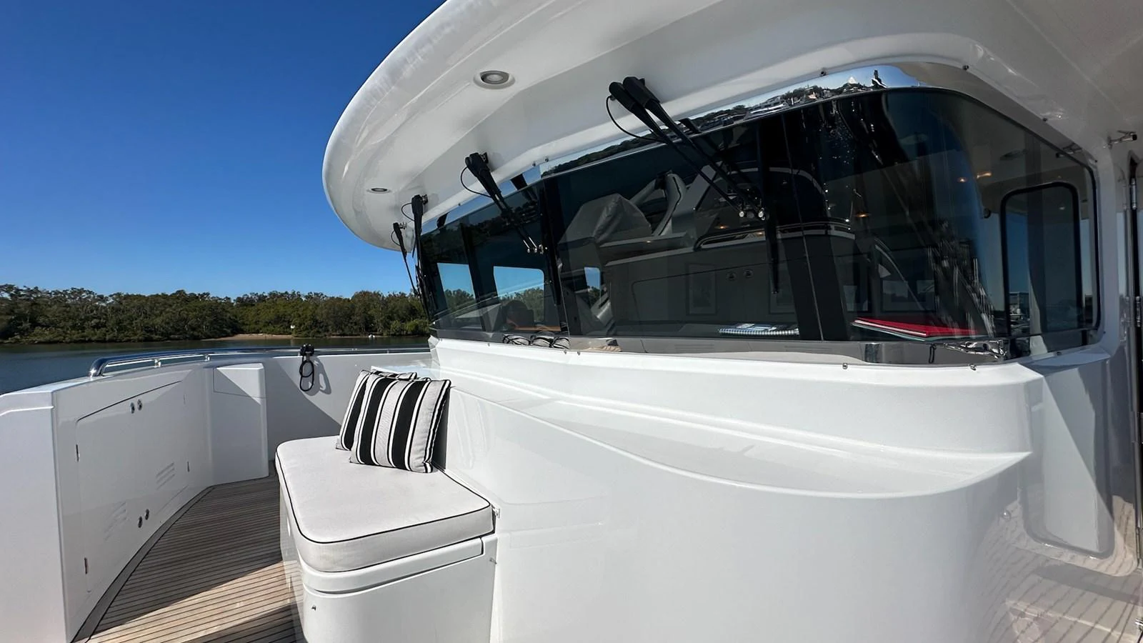 a white boat with a black canopy aboard SALVATOR II Yacht for Sale