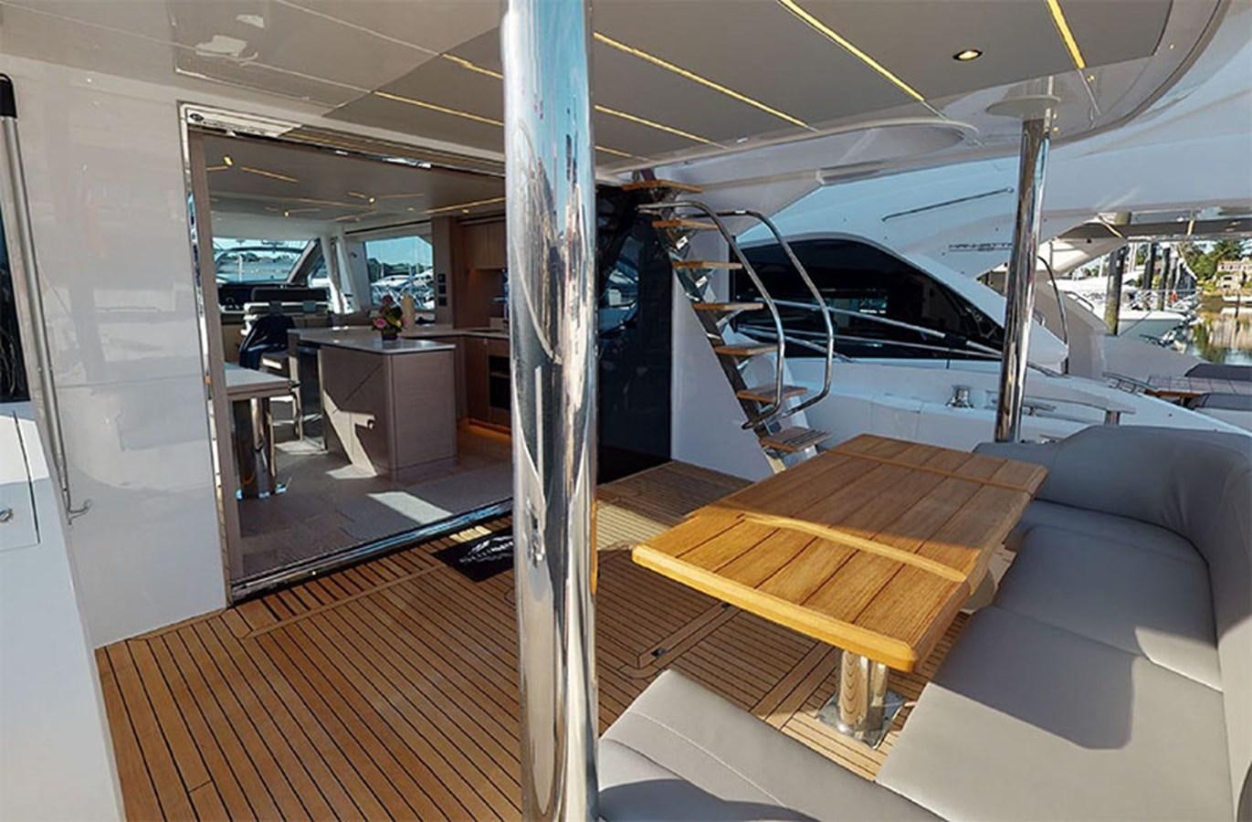 a room with a couch and a table aboard SM Yacht for Sale