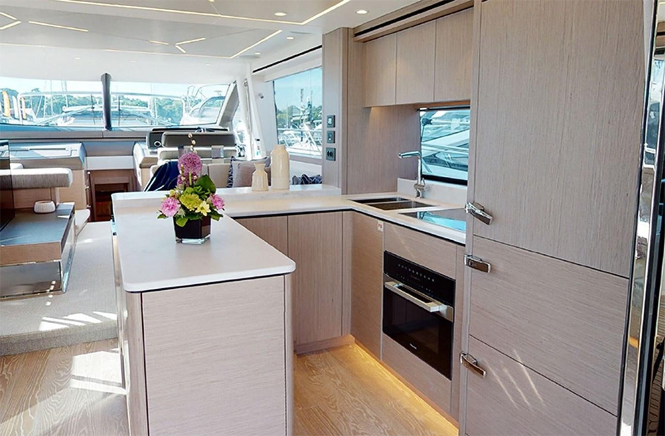 a kitchen with a large refrigerator aboard SM Yacht for Sale