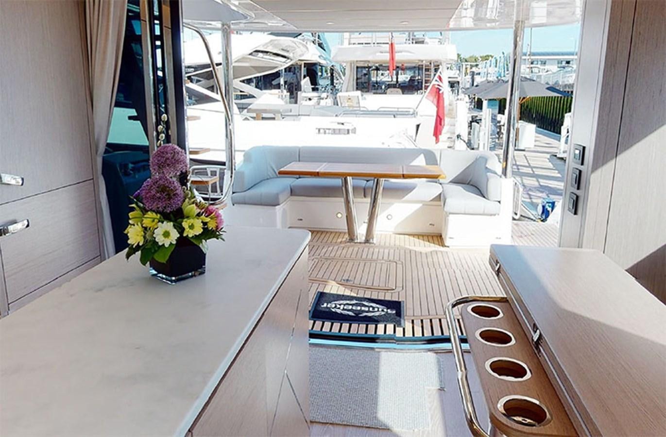 a room with a table and chairs aboard SM Yacht for Sale